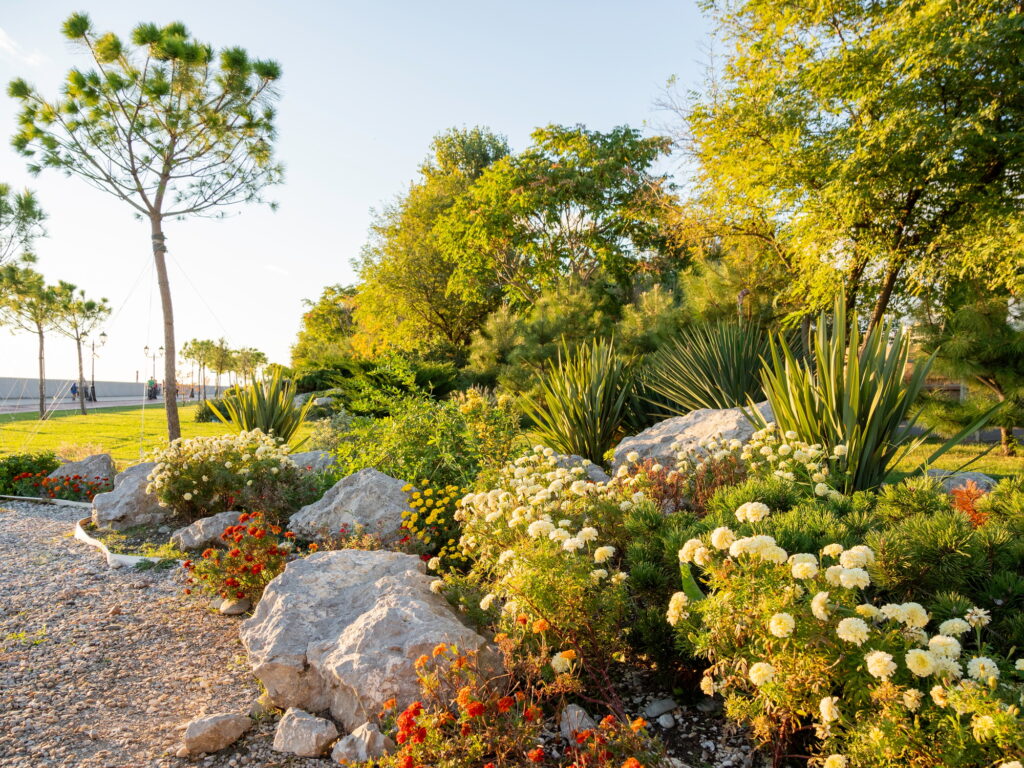 Urban landscaping. Flower bed with colorful plants and bushes.